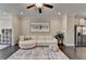Inviting living room with hardwood floors, white sofa, and elephant-themed wall art at 373 Via Secco Ln, Suwanee, GA 30024