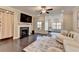 Spacious living room features a fireplace, hardwood floors, and large windows at 373 Via Secco Ln, Suwanee, GA 30024