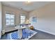 Bright office features hardwood floors, a blue and white rug and great natural light at 373 Via Secco Ln, Suwanee, GA 30024