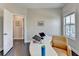 Bright office with hardwood floors, a modern white desk and great natural light at 373 Via Secco Ln, Suwanee, GA 30024