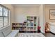 Playroom with a couch and a window, surrounded by bookshelves and toys at 373 Via Secco Ln, Suwanee, GA 30024