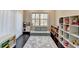 Cozy playroom features a reading nook, toy kitchen, and a car-themed rug at 373 Via Secco Ln, Suwanee, GA 30024