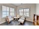 Bright sitting area with large windows and dark hardwood floors at 373 Via Secco Ln, Suwanee, GA 30024