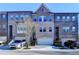 Charming brick townhomes feature attached garages and a traditional architectural style at 373 Via Secco Ln, Suwanee, GA 30024