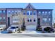 Charming brick townhomes feature attached garages and a traditional architectural style at 373 Via Secco Ln, Suwanee, GA 30024