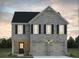 Charming two-story brick home featuring a two-car garage and well-manicured landscaping at 5320 Tolar Rd, South Fulton, GA 30213