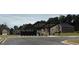 Street view of mailboxes and covered parking near a neighborhood park and playground at 5320 Tolar Rd, South Fulton, GA 30213