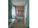 Tiled bathroom featuring a bathtub, toilet, vanity with a sink, and a shower head at 5430 Old Bill Cook Rd, Atlanta, GA 30349