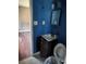 Bathroom featuring blue walls, a sink, toilet and linoleum flooring at 5430 Old Bill Cook Rd, Atlanta, GA 30349
