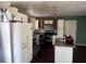 Kitchen with white cabinets, stainless steel appliances, and a granite countertop island at 5430 Old Bill Cook Rd, Atlanta, GA 30349