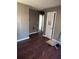 A view of the living room, with an unfinished hardwood floor at 5430 Old Bill Cook Rd, Atlanta, GA 30349