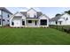 New construction home featuring a spacious backyard, patio, and black trimmed windows at 574 Sawnee Village Blvd, Cumming, GA 30040