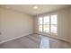 Bedroom with a window and neutral carpet, and white trim at 574 Sawnee Village Blvd, Cumming, GA 30040