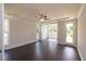Bright bedroom with tray ceilings, hardwood floors and access to backyard at 574 Sawnee Village Blvd, Cumming, GA 30040