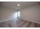Neutral-toned bedroom with carpet and a window providing natural light at 574 Sawnee Village Blvd, Cumming, GA 30040