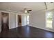 Bright bedroom with tray ceilings, hardwood floors, and attached bathroom at 574 Sawnee Village Blvd, Cumming, GA 30040
