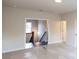 Bedroom with carpet, neutral walls, and doorway to hallway with hardwood staircase at 574 Sawnee Village Blvd, Cumming, GA 30040