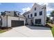 Beautiful two-story home with a dark gray two car garage and a well maintained front yard at 574 Sawnee Village Blvd, Cumming, GA 30040