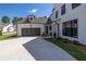 Beautiful home with a dark gray two car garage and a well maintained front yard at 574 Sawnee Village Blvd, Cumming, GA 30040