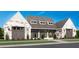 Stunning new construction home features a three car garage and stylish brick exterior at 574 Sawnee Village Blvd, Cumming, GA 30040