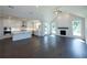 Spacious open kitchen with a large island, stainless appliances and living room with fireplace at 574 Sawnee Village Blvd, Cumming, GA 30040