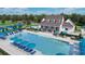 Community pool and lounge area with pickleball court and clubhouse in a beautiful setting at 574 Sawnee Village Blvd, Cumming, GA 30040