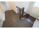 Hardwood staircase showcasing the beautiful wood railing and black iron balusters at 574 Sawnee Village Blvd, Cumming, GA 30040