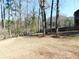 Large, open backyard with some scattered trees and debris at 1546 Alverado Way, Decatur, GA 30032