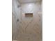 Bathroom with a glass shower, rainfall shower head, and marble-style tiles at 1546 Alverado Way, Decatur, GA 30032