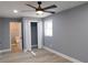 Bedroom with ceiling fan, closet, and attached bathroom at 1546 Alverado Way, Decatur, GA 30032