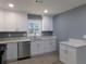 Bright kitchen with stainless steel appliances and white cabinets and countertops at 1546 Alverado Way, Decatur, GA 30032