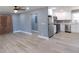 Open-concept living room view that goes into the kitchen with stainless steel appliances at 1546 Alverado Way, Decatur, GA 30032