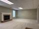 Spacious carpeted basement with a cozy brick fireplace at 3336 Franklin Forest Dr, Winston, GA 30187
