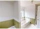 Well-lit bathroom with soaking tub and shower at 3336 Franklin Forest Dr, Winston, GA 30187