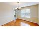 Inviting dining room with hardwood floors and a chandelier, perfect for Gathering gatherings at 3336 Franklin Forest Dr, Winston, GA 30187