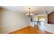 Elegant dining room with hardwood floors and a chandelier, offering a seamless view into other living spaces at 3336 Franklin Forest Dr, Winston, GA 30187