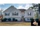 Charming two-story home featuring a well-maintained lawn, trimmed bushes, and a welcoming front entrance at 3336 Franklin Forest Dr, Winston, GA 30187