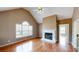 Cozy living room with hardwood floors, a fireplace, vaulted ceiling, and abundant natural light at 3336 Franklin Forest Dr, Winston, GA 30187