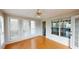 Light-filled sunroom offers ample windows with backyard views and access to the main house at 3336 Franklin Forest Dr, Winston, GA 30187