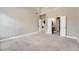 Expansive bedroom with multiple doorways to closet and bathroom at 5430 Falls Landing Dr, Cumming, GA 30040