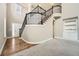Grand foyer with staircase, hardwood floors, and natural light at 5430 Falls Landing Dr, Cumming, GA 30040