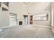 Open-concept living room with a fireplace and soaring ceilings at 5430 Falls Landing Dr, Cumming, GA 30040