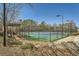 Community tennis court in a wooded area at 5430 Falls Landing Dr, Cumming, GA 30040