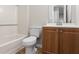 Bathroom with modern fixtures, including a vanity cabinet and a bathtub at 801 Hemingway Rd, Stone Mountain, GA 30088