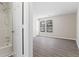 Bedroom with bath tub and shower in view and two windows for natural light at 801 Hemingway Rd, Stone Mountain, GA 30088