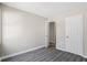 Serene bedroom with open door showcasing the gray floors and white trim at 801 Hemingway Rd, Stone Mountain, GA 30088