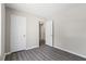 Bedroom with gray floors and white doors, offering a minimalist design at 801 Hemingway Rd, Stone Mountain, GA 30088