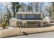 Charming home featuring a covered porch, painted in blue, and a neatly kept front yard at 801 Hemingway Rd, Stone Mountain, GA 30088