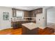 Kitchen featuring granite countertops, dark cabinets, and stainless steel sink at 801 Hemingway Rd, Stone Mountain, GA 30088