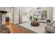 Bright living room with large windows, neutral walls and a cozy fireplace at 801 Hemingway Rd, Stone Mountain, GA 30088